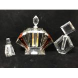A large art deco fan shaped shop display perfume bottle in clear and amber glass, possible