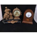 A 19th century gilt painted mantel clock, with a spelter cast figure emblematic of learning, the