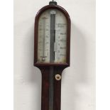 A mercury stick barometer by I Brunner, London, with arched top and carved ball base (af)