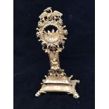A 19th century ormolu bronze watch stand, with rectangular pedestal base supporting a foliate