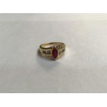An 18ct gold ring, claw set with a marquise cut ruby, estimated weight of ruby 0.70cts, the