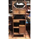 A 19th century stained walnut cupboard in the 'aesthetic' style, with pierced fret spandrels, and