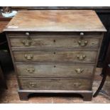 A George III faded mahogany four-drawer bachelor chest of drawers, with baize-covered brushing