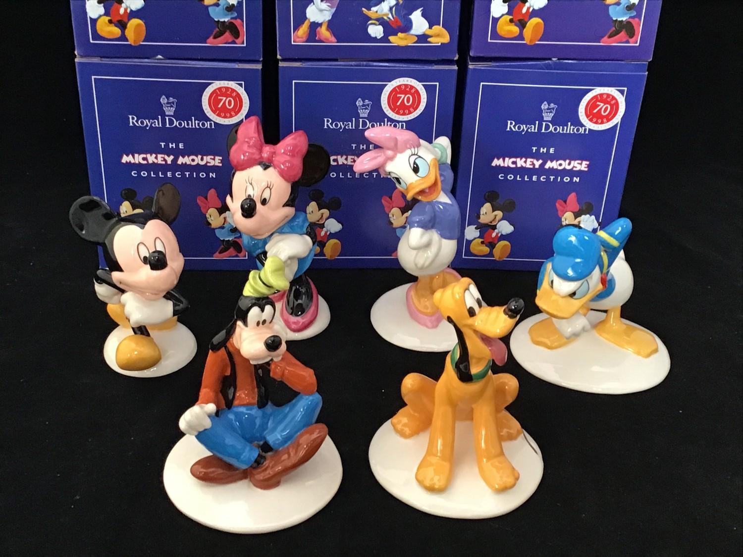 A set of six Royal Doulton ceramic figures from the Mickey Mouse Collection celebrating 70 years