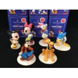 A set of six Royal Doulton ceramic figures from the Mickey Mouse Collection celebrating 70 years