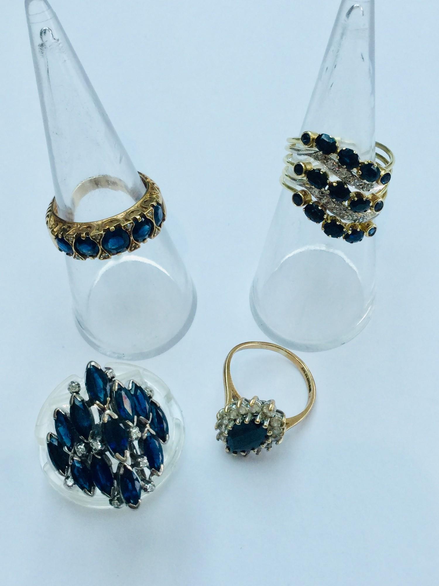 A collection of gold sapphire rings. Including 3 x 9ct yellow gold, and 1 x 18ct white gold ring.