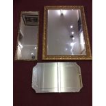 A rectangular giltwood wall mirror with bevelled glass, 106x77cm, together with another