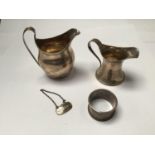 Two silver cream jugs, one by Charles Boyton & Son Ltd, hallmarked Birmingham, 1925, together with a