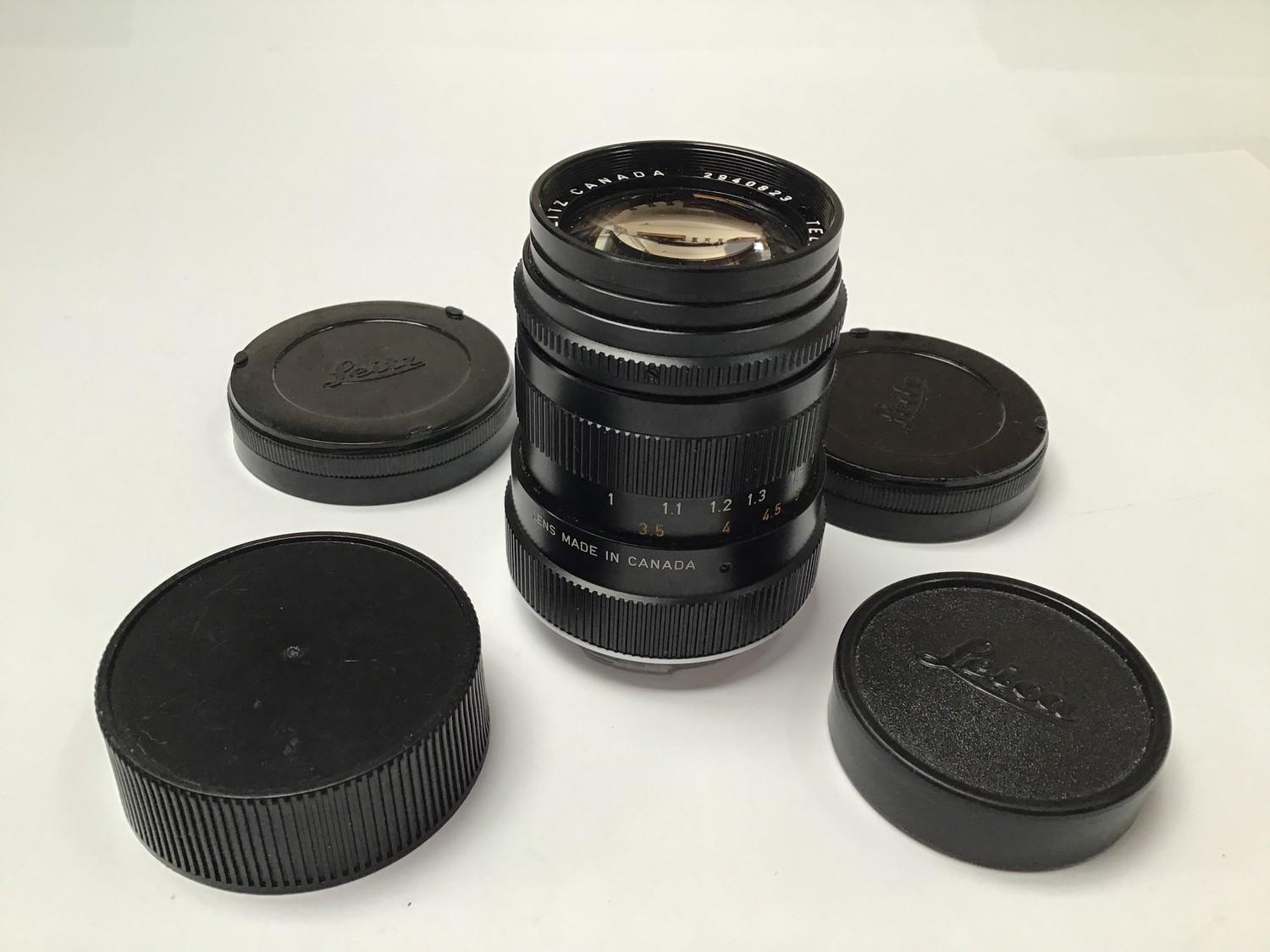 A Leitz Canada Tele-Elmarit 90mm 1:2.8/90 lens and two spare covers - Image 2 of 3