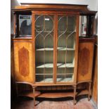 A good quality Edwardian mahogany, satinwood and boxwood veneered two-door display cabinet in the