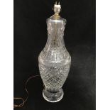 A large Waterford crystal lamp, of baluster form, geometric decoration, raised on fluted circular