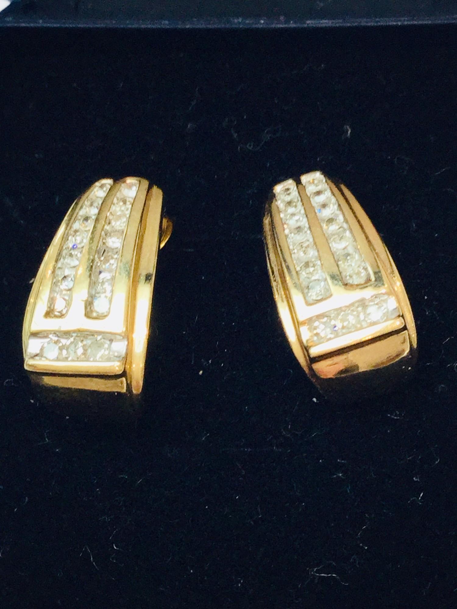 A 9ct gold dress ring set with baguette and round brilliant cut diamonds in a channel and claw - Image 2 of 3