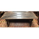A late 17th century refectory table of rectangular form with elm planked top, oak cleated ends and
