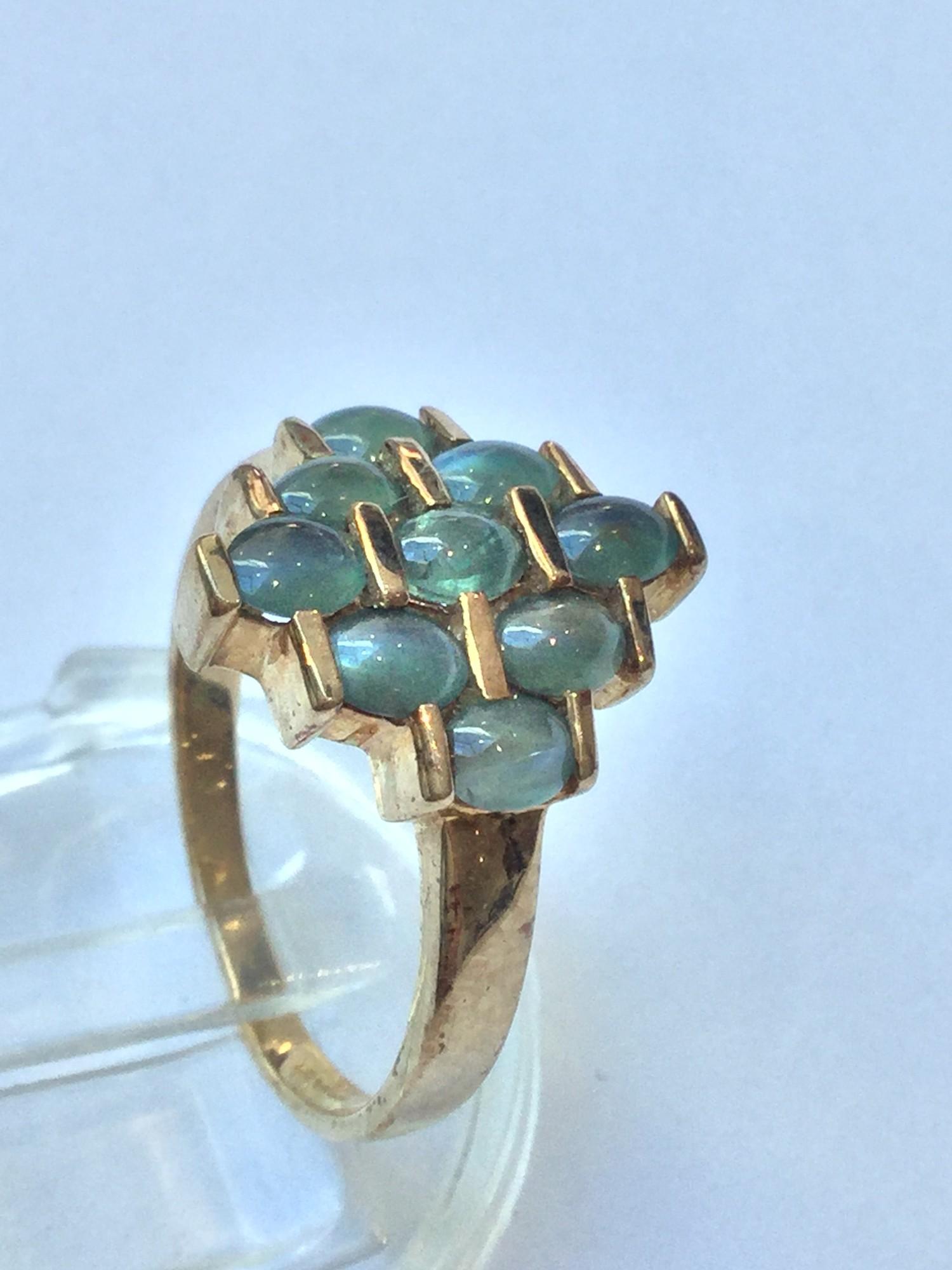 A 9ct gold dress ring, set with 9 x green cabochon stones. Ring weighs 3.2 grams, finger size N. - Image 2 of 3