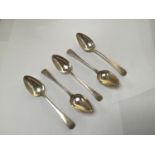 Five assorted silver 'Old English' pattern table spoons, four by William Eley & William Fearn,
