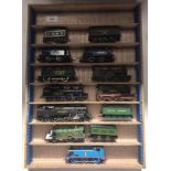 Nine various unboxed "OO" gauge locomotives and four unboxed "OO" gauge tenders. (AF)