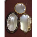 An oval 'Chinoiserie' wall mirror, 80cm, floral cartouche mirror, 75cm, and circular gilt mirror,
