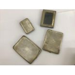 Three assorted silver cigarette cases comprising an English example by Turner Brothers, profusely