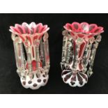 Two various Victorian bohemian cranberry and white overlay glass lustres with scalloped rims, one