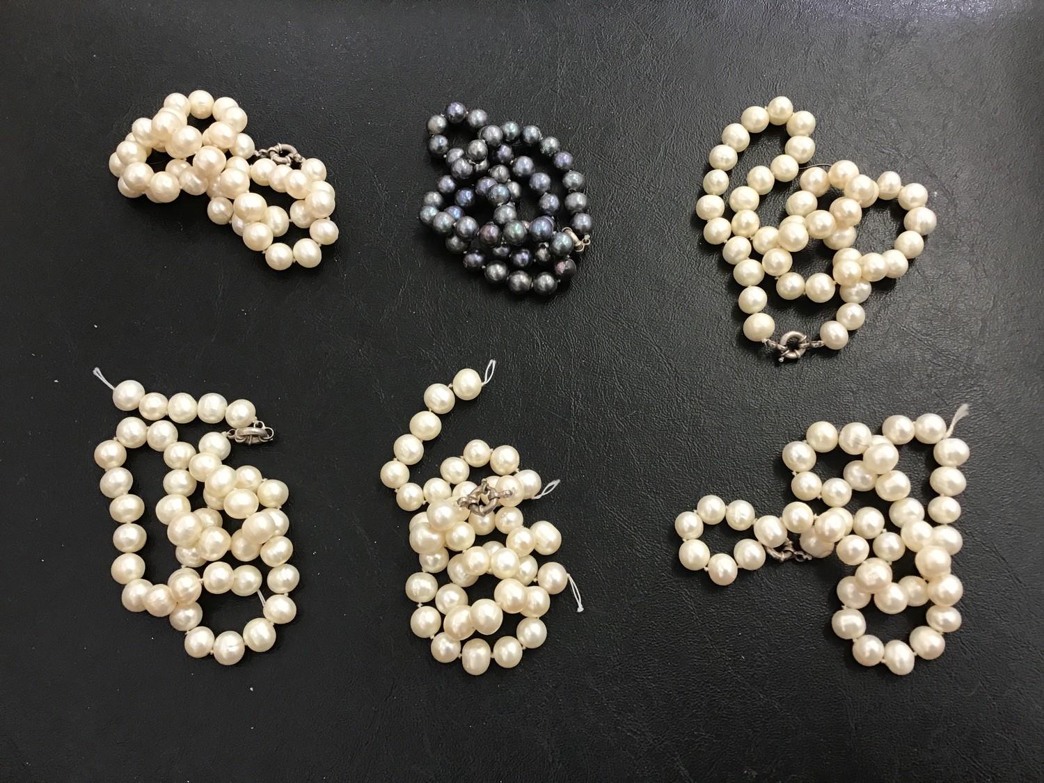 Five strings of cultured, freshwater pearls, each with white metal clasps (2 strings AF) together