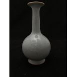 A Chinese celadon crackle-glazed vase, of shaft and globe form, 19 cm tall