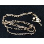 A 9ct gold chain with footballer pendant, approx. 12.9g, the chain approx. 71cm long, the pendant