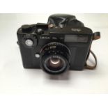 A Leica CL, black finish, serial no. 1317880, 1973-74, with standard lens and case - appears in very
