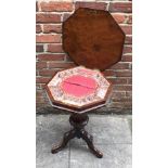 A Victorian walnut and burr walnut ladies work table, the octagonal hinged top enclosing a paper-