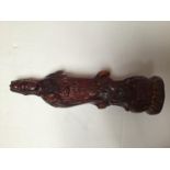 A chinese amber coloured carving of Guan Yin on a lotus leaf base, 32cm high, together with a