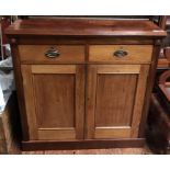An Edwardian stained walnut chiffoniere with a pair of drawers above cupboards, on plinth base,