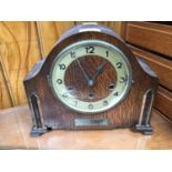An early 20th century oak cased mantel clock, with silent/Whittington/Westminster chime features,