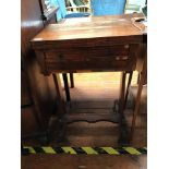 A 19th century rosewood work table with hinged top enclosing green baize and two frieze drawers,