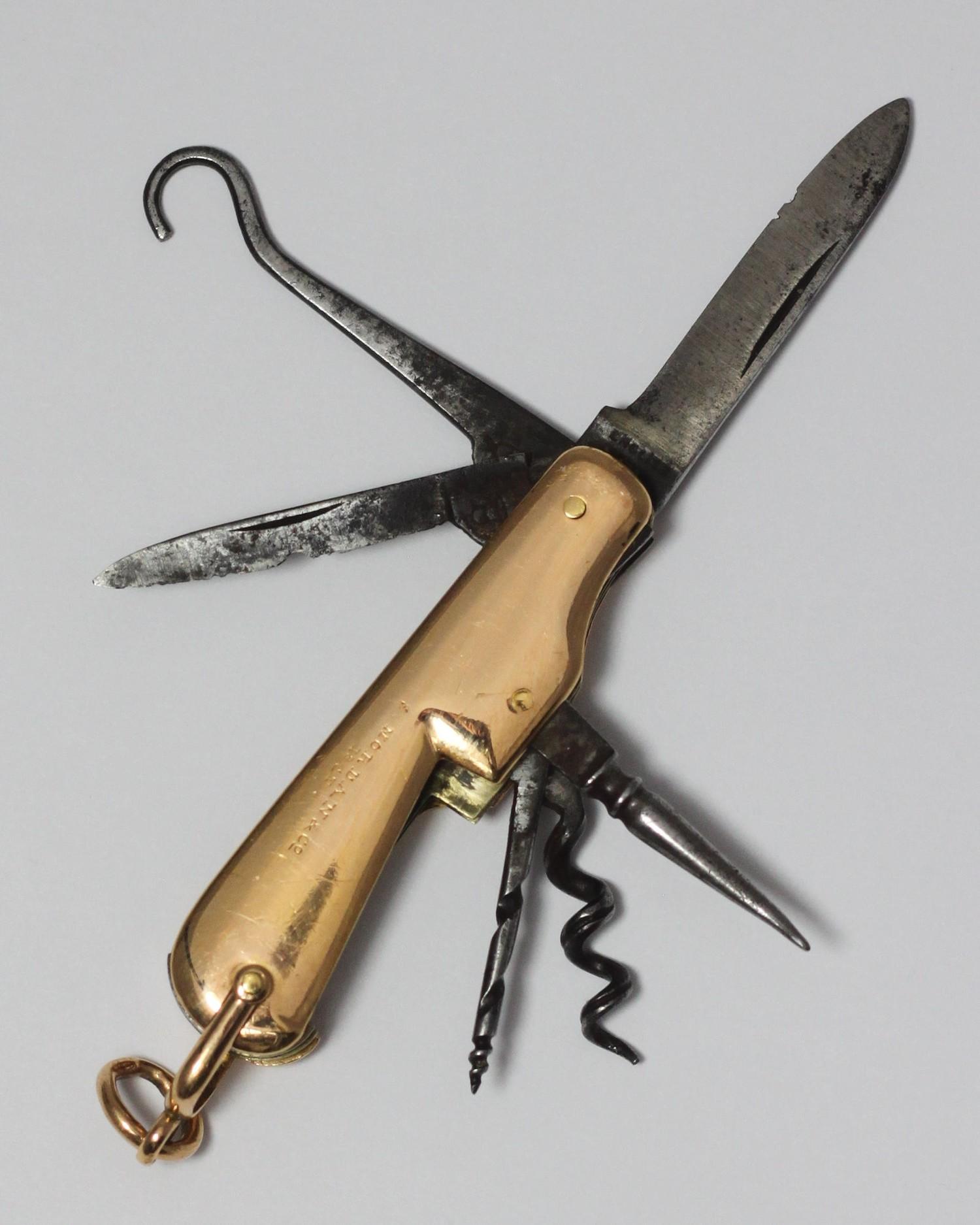 An 18ct gold multi-tool pocket knife by Sampson Mordan & Co. with knife and corkscrew etc. One