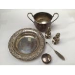 A small collection of assorted silver items comprising a small dish, a two handled pot, a pair of