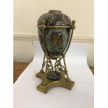 A Doulton Lambeth stoneware and brass oil lamp, the egg shaped body incised with panels of