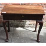 A mid-18th century mahogany folding tea table, of rectangular form, solid mahogany top, raised on