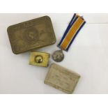 WITHDRAWN A small collection of assorted WWI items comprising a Christmas 1914 cigarette tin, a tre