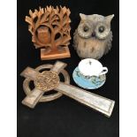 A ceramic owl modelled to look like driftwood, together with a wooden carved owl ornament, a large