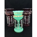 A pair of Victorian ruby glass lustres of typical baluster form, with gilt highlighted scalloped