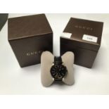 A gents Gucci 'YA101203' Chronograph wristwatch, the textured black dial with batons denoting