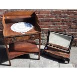 A 19th century mahogany wash stand with shaped three-quarter raised back, single frieze drawer and