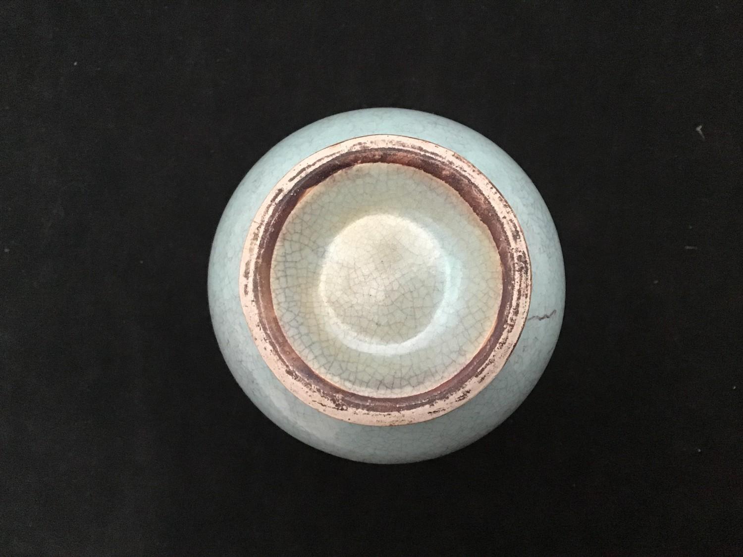 A Chinese celadon crackle-glazed vase, of shaft and globe form, 19 cm tall - Image 3 of 3