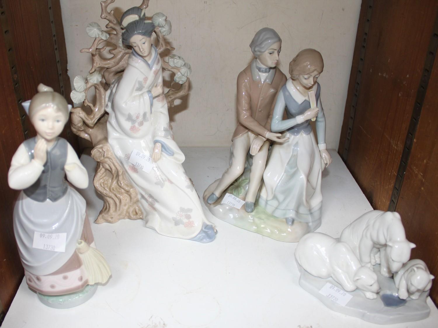 SECTION 22. A Lladro figure group of three polar bears, together with a Lladro figure of an Oriental