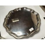 A shaped silver salver by Walker & Hall with gadrooned, pie-crust rim, hallmarked Sheffield, 1923,