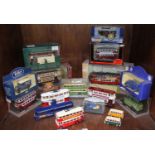An assortment of model buses, trams, omnibuses and vans (boxed & unboxed) (17)