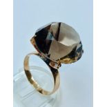 A 14ct yellow gold Smokey Quartz dress ring, weighing 8.5 grams, finger size Q. Together with a 14ct