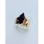 Two yellow gold Amethyst dress rings. The 9ct gold oval shaped amethyst is in a rub over heart