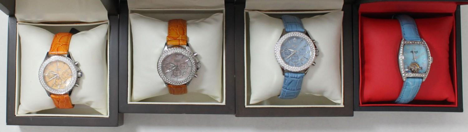 Four assorted ladies wristwatches comprising three Trias examples, each with coloured dials,