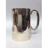 A Silver Christening tankard, of plain tapering cylindrical form with loop handle, Sheffield,