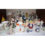 SECTION 13. A quantity of Staffordshire pottery ornaments including castles, figures and '